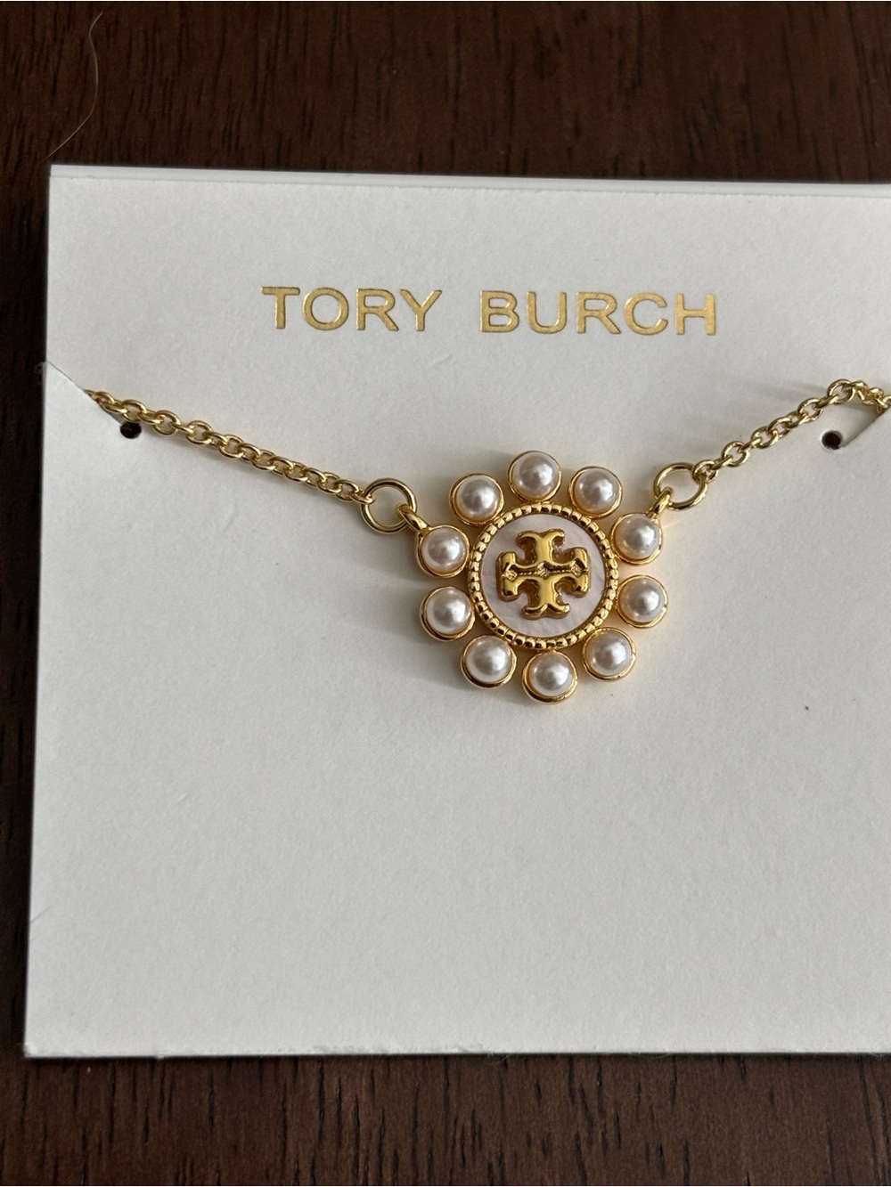 Brand new Tory Burch Gold Medallion Necklace with Pearl Accents